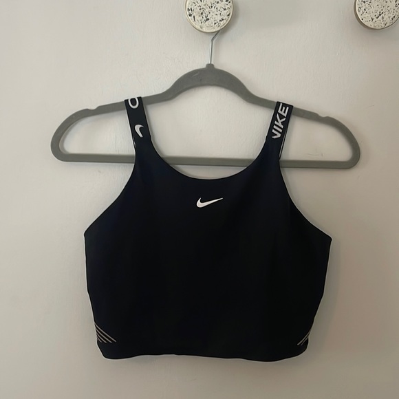 Nike Pro Tops - Nike Pro dri-fit women’s sized medium sports bra never been worn.  Brand new.